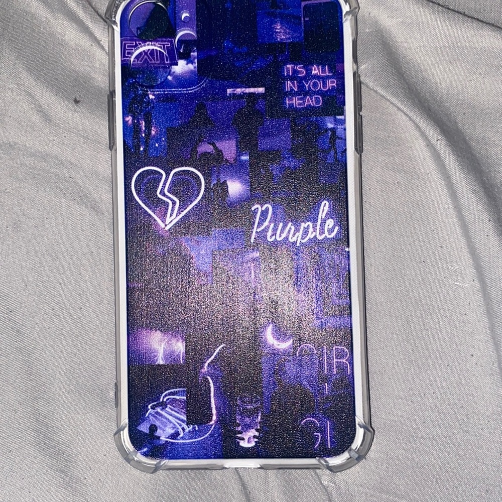 Purple Iphone 11 phone case with graphic designs.